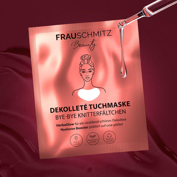 FrauSchmitz Beauty décolleté mask packaging with serum drop for hydration effect on a red background.