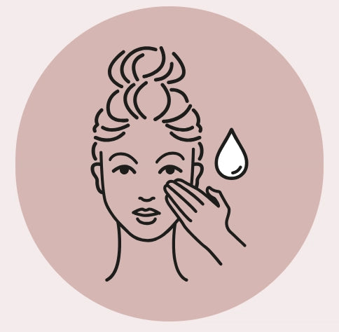 Illustration of a hand touching a face with a droplet on a pink background