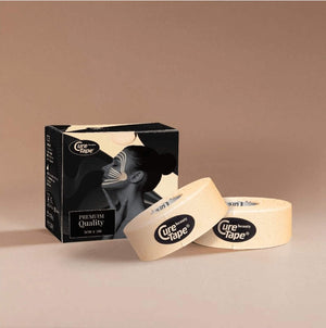 Cure Tape packaging with two rolls of tape on a beige background