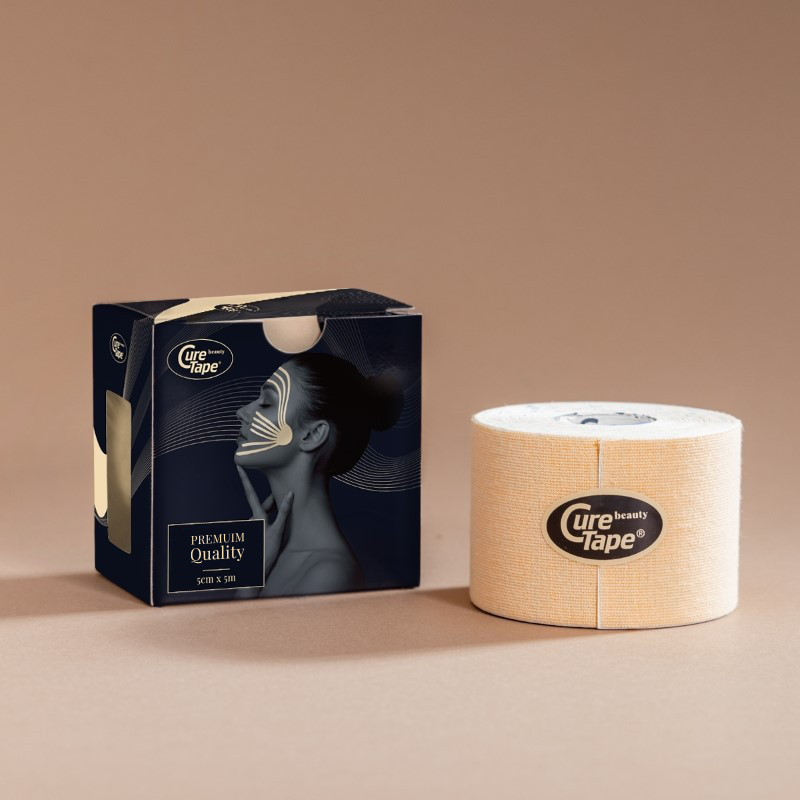 CureTape Beauty 5 cm beige cosmetic lifting tape for soothing and improving skin elasticity on a beige background