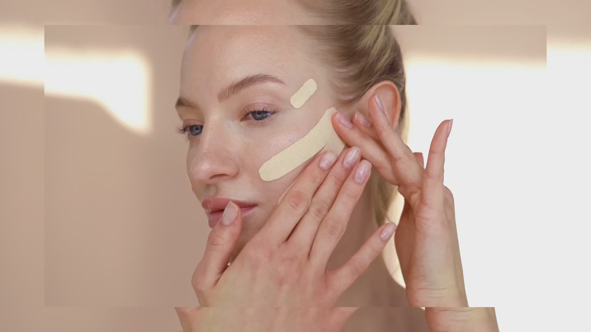 Models applying face tape for face lifting effect and to reduce swelling around eye are and to sooth wrinkles on forehead